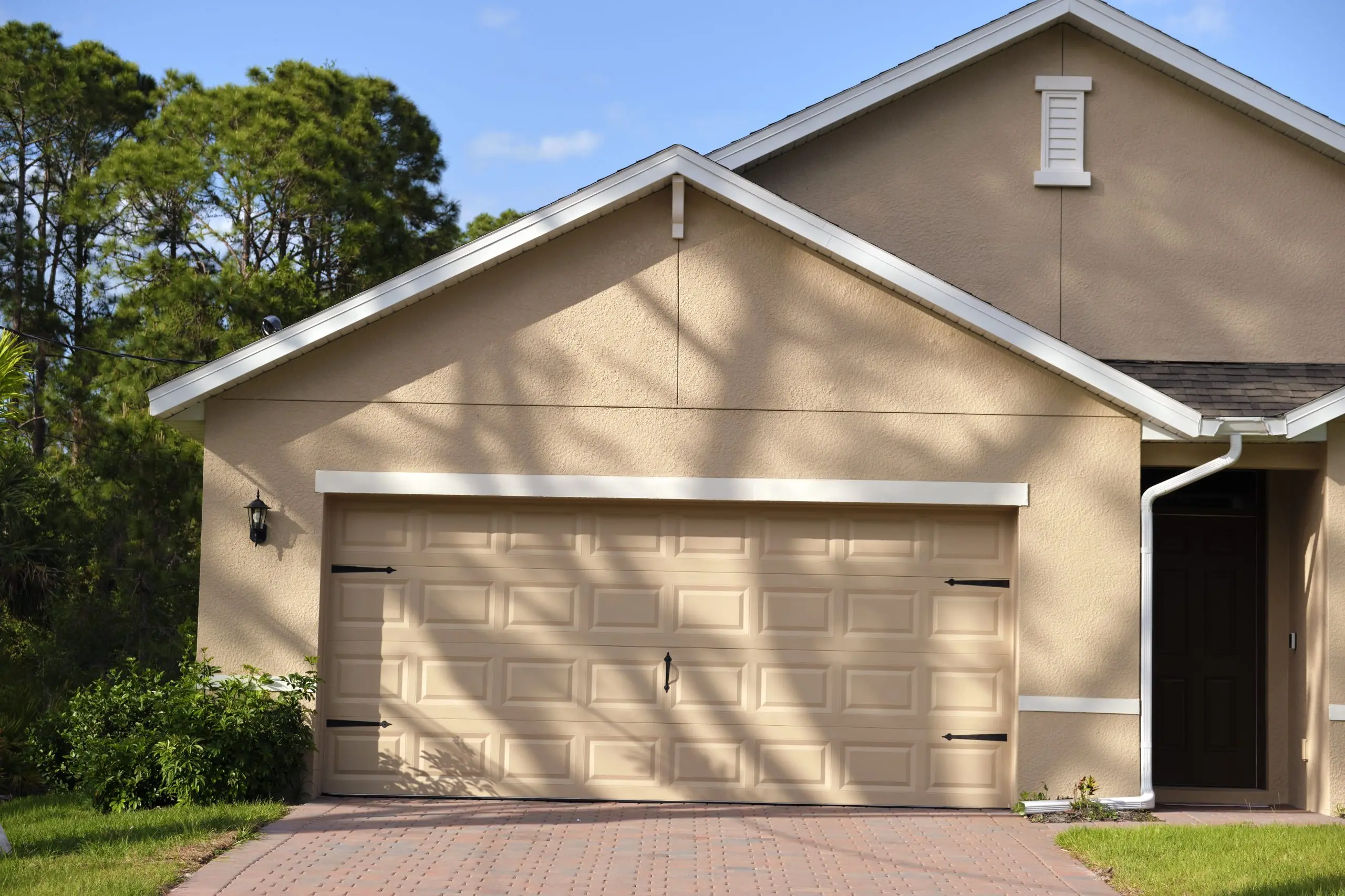 Wide garage double door concrete driveway — new modern american house