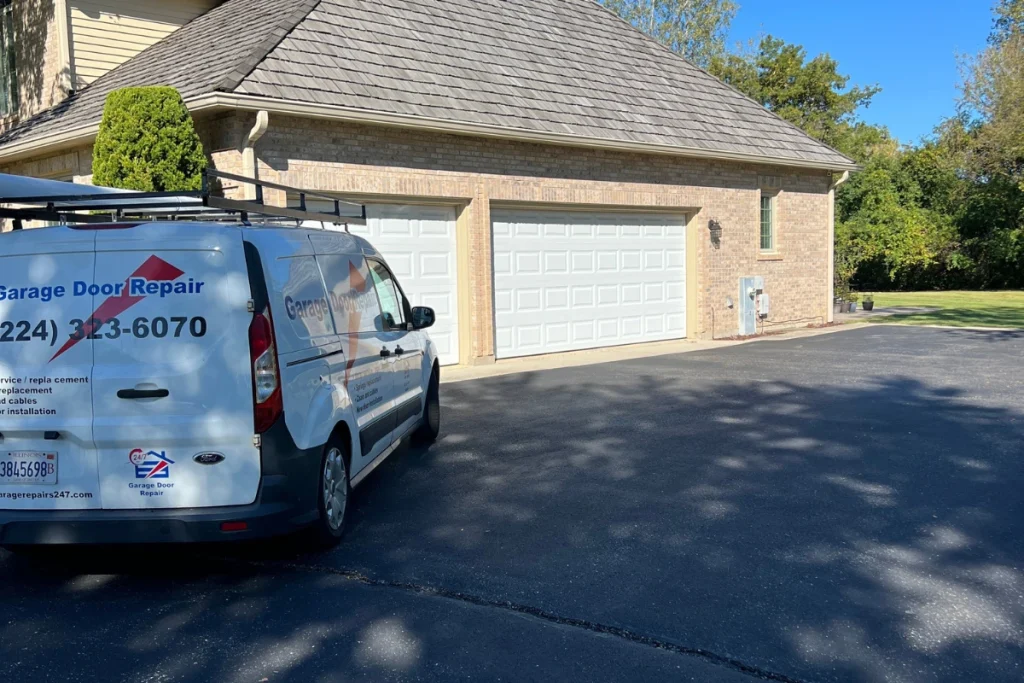 garage door repair service car near white garage doors